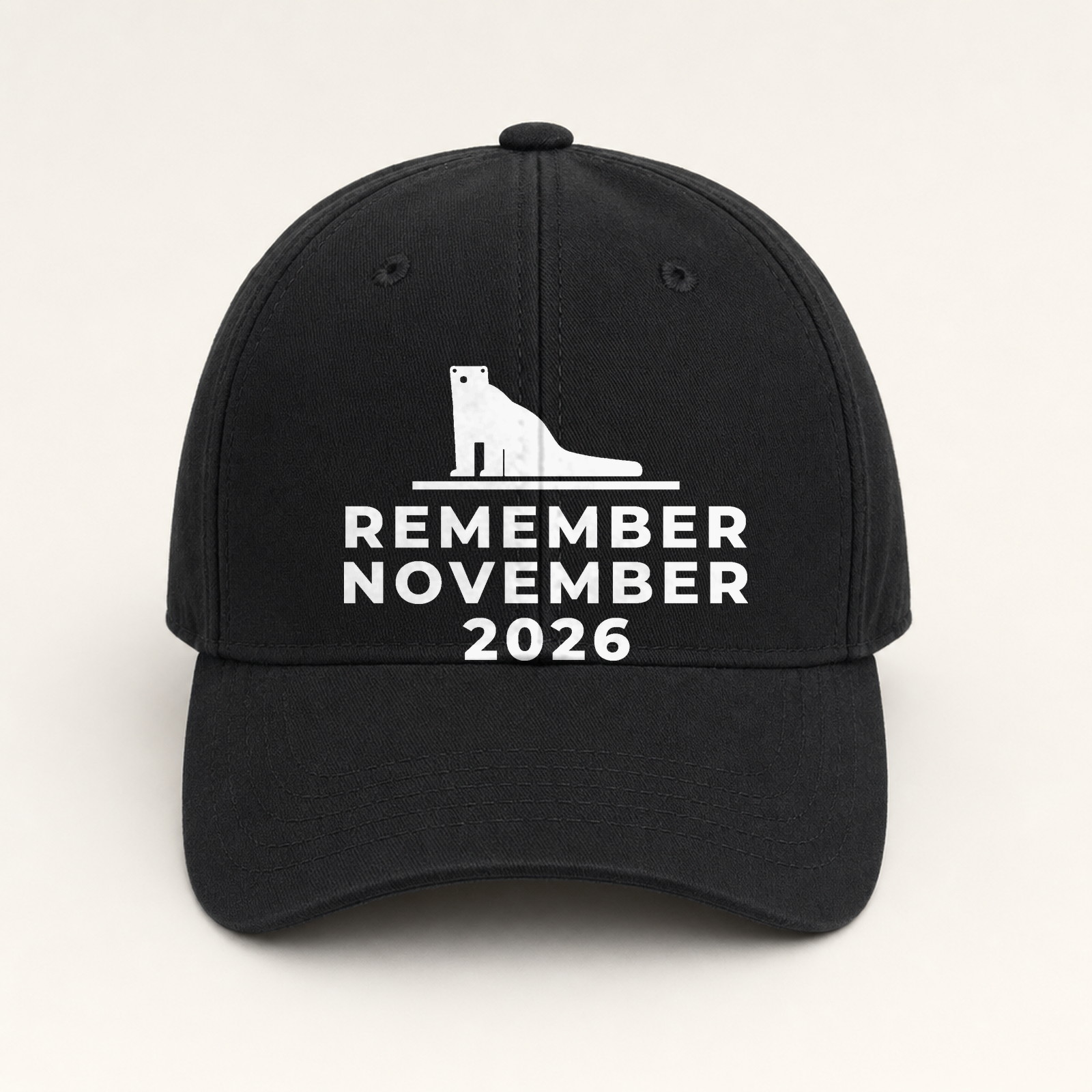 Black dad hat with a bear embroidered above November 2026 lettering