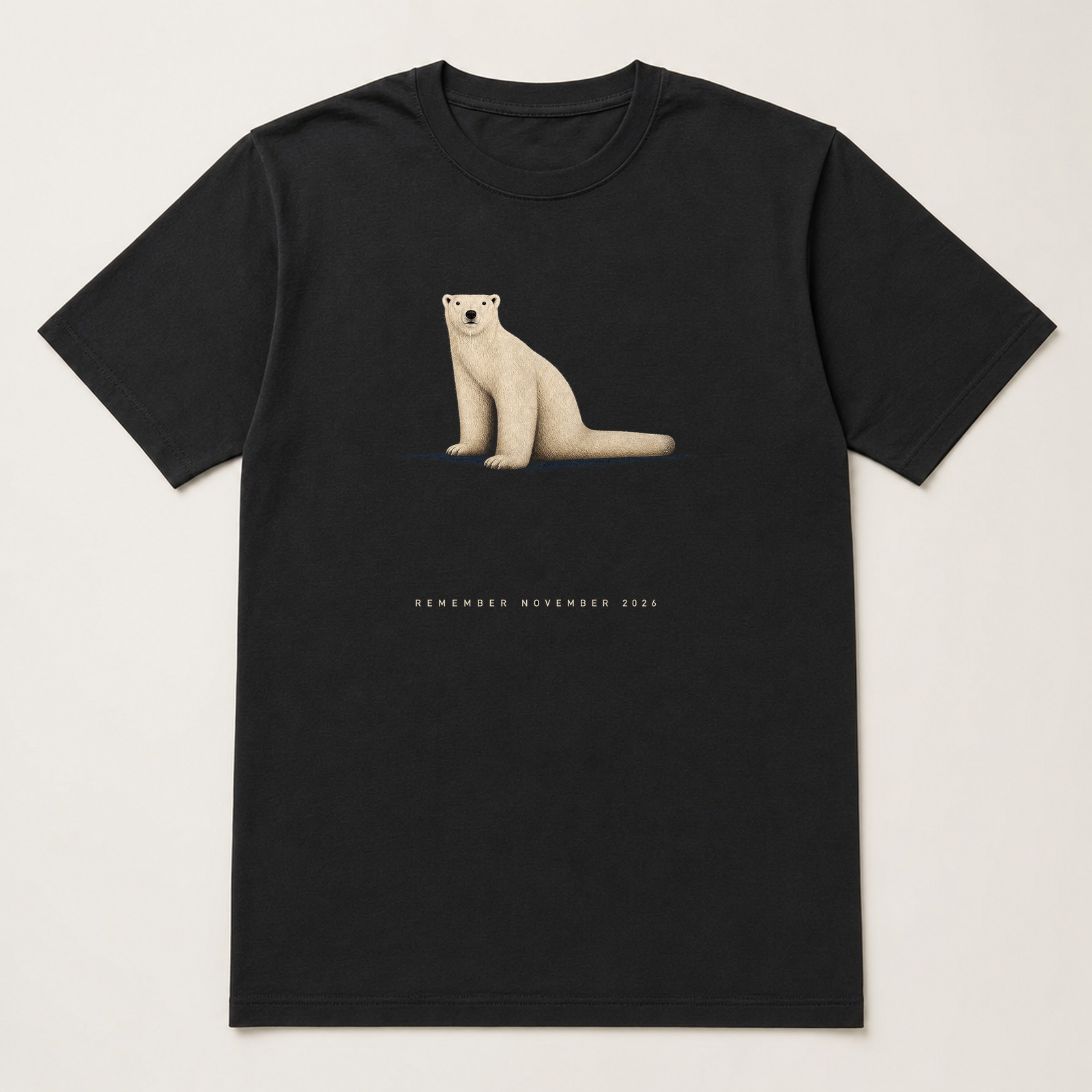 Black tee with a lone polar bear in the dark and November 2026 lettering